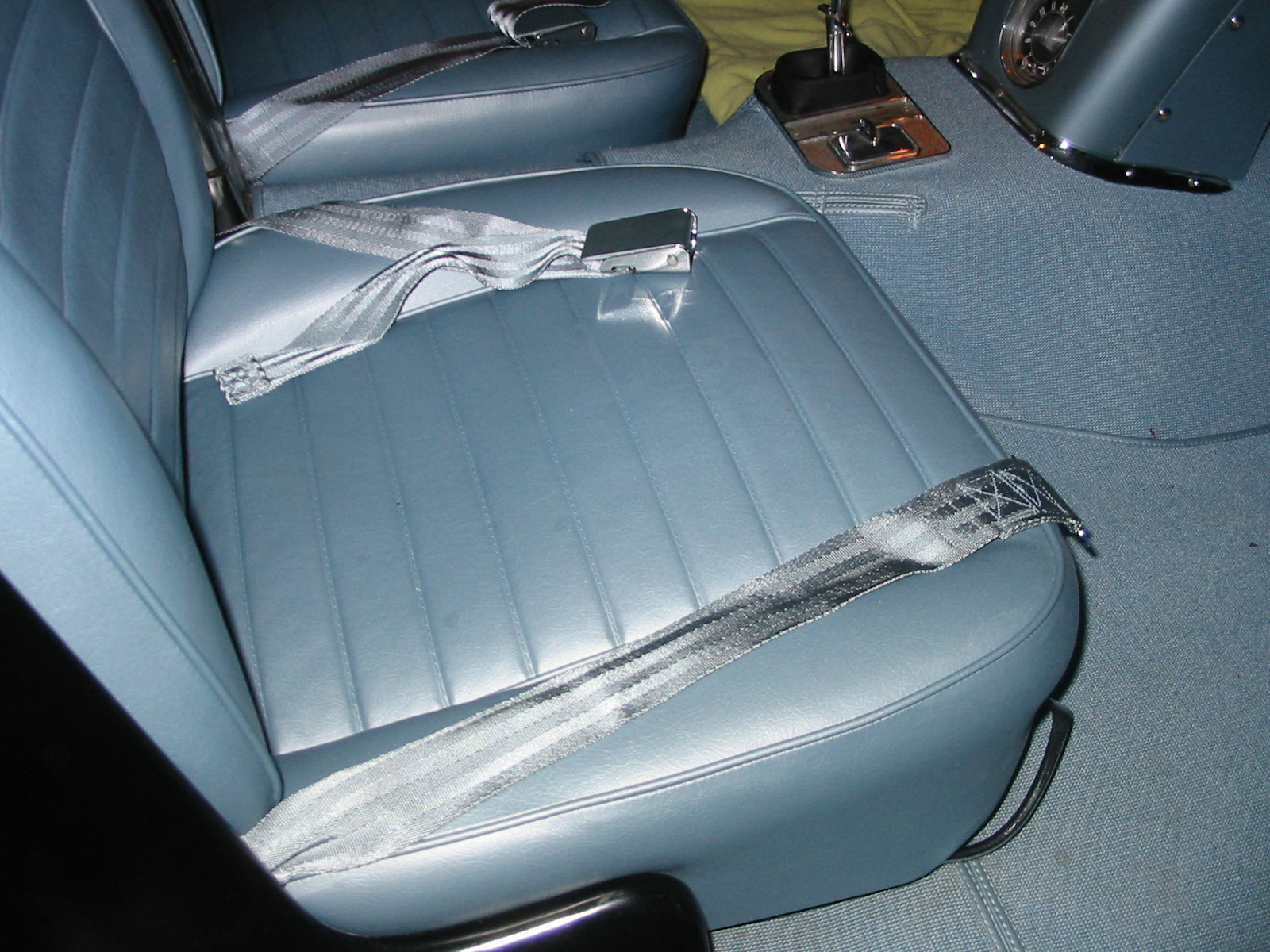 View of right blue seat and seat belts