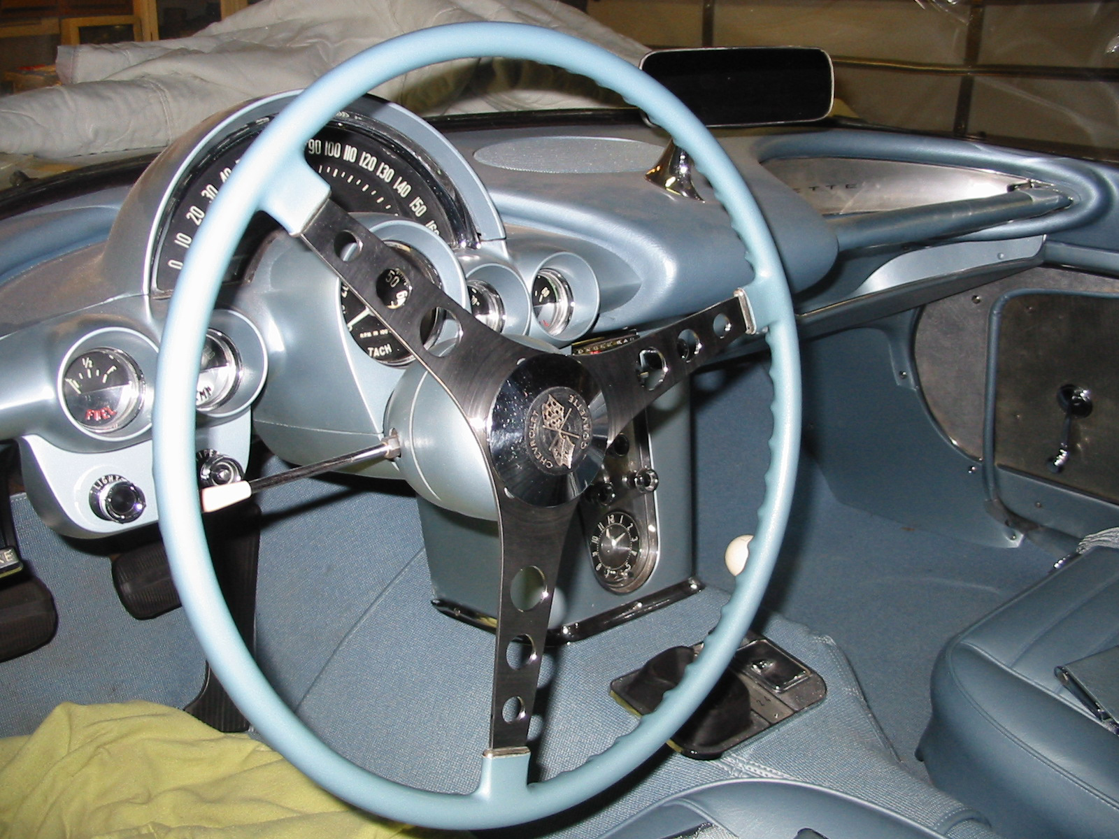 View of blue steering wheel and dash of 1959 Corvette